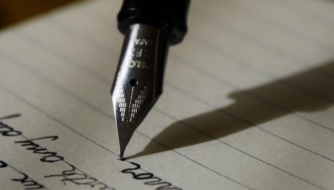 Fountain pen writing on lined paper