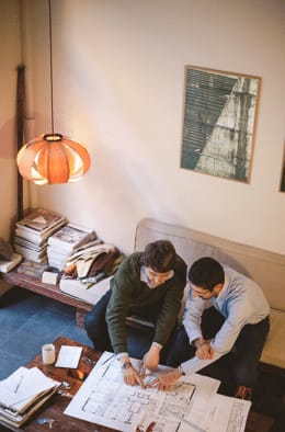 two architects with a drawing
