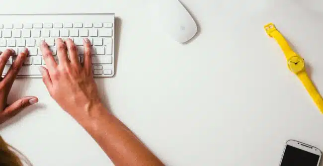 Person using Apple computer at desk